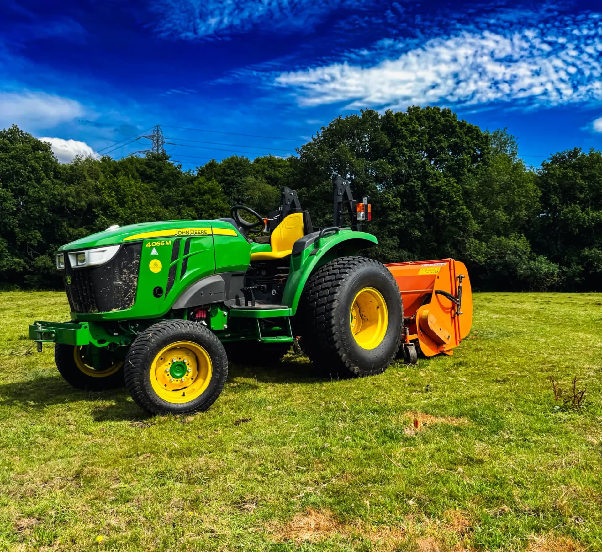 John Deere 4066M flail collecting
